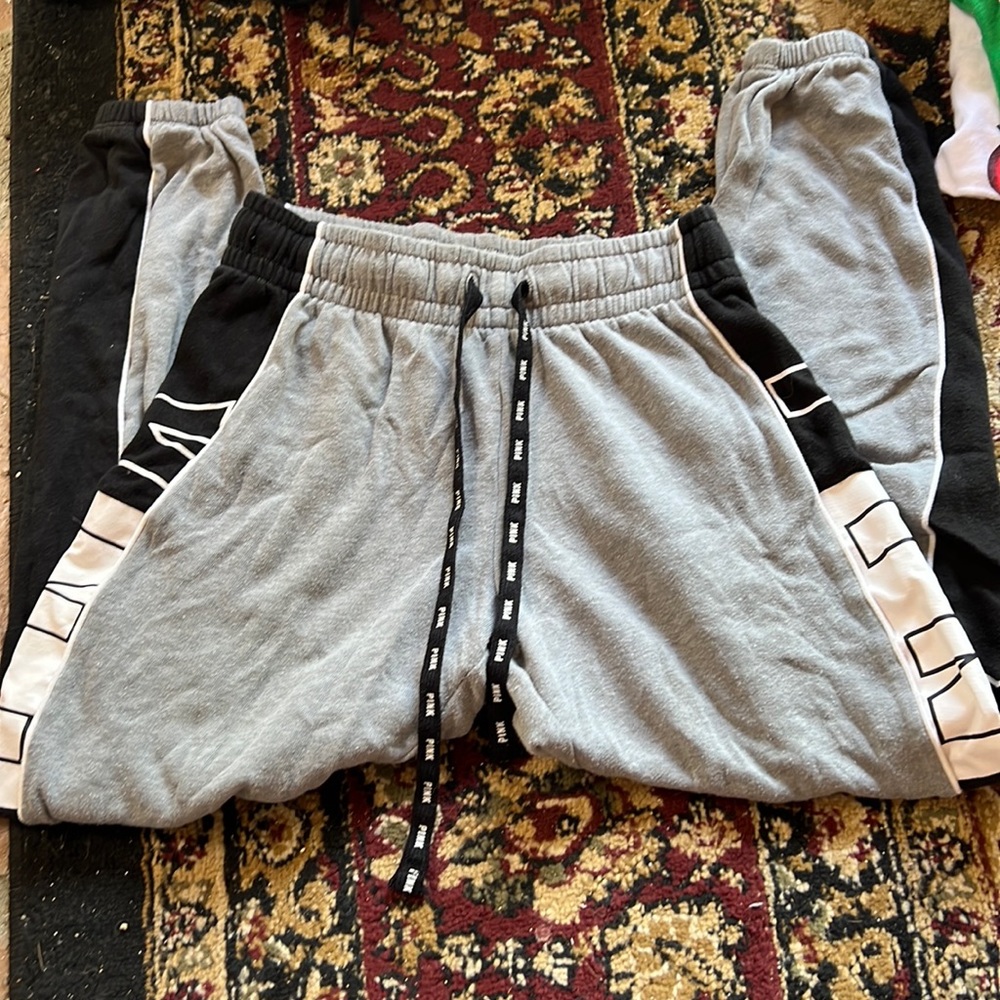 3 pink and 1 adidas sweatpants